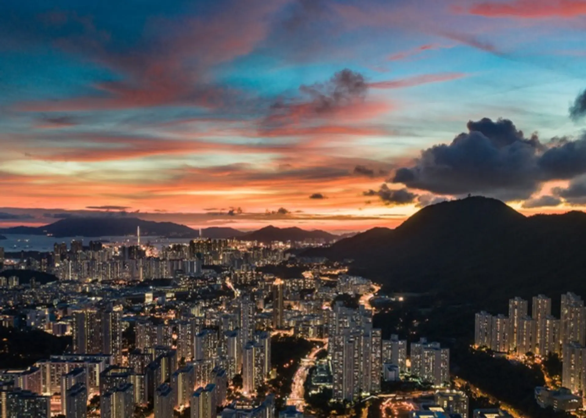 The Hong Kong skyline and hills under a vivid sunset sky, for Sylvie di Giusto, international keynote speaker in Hong Kong