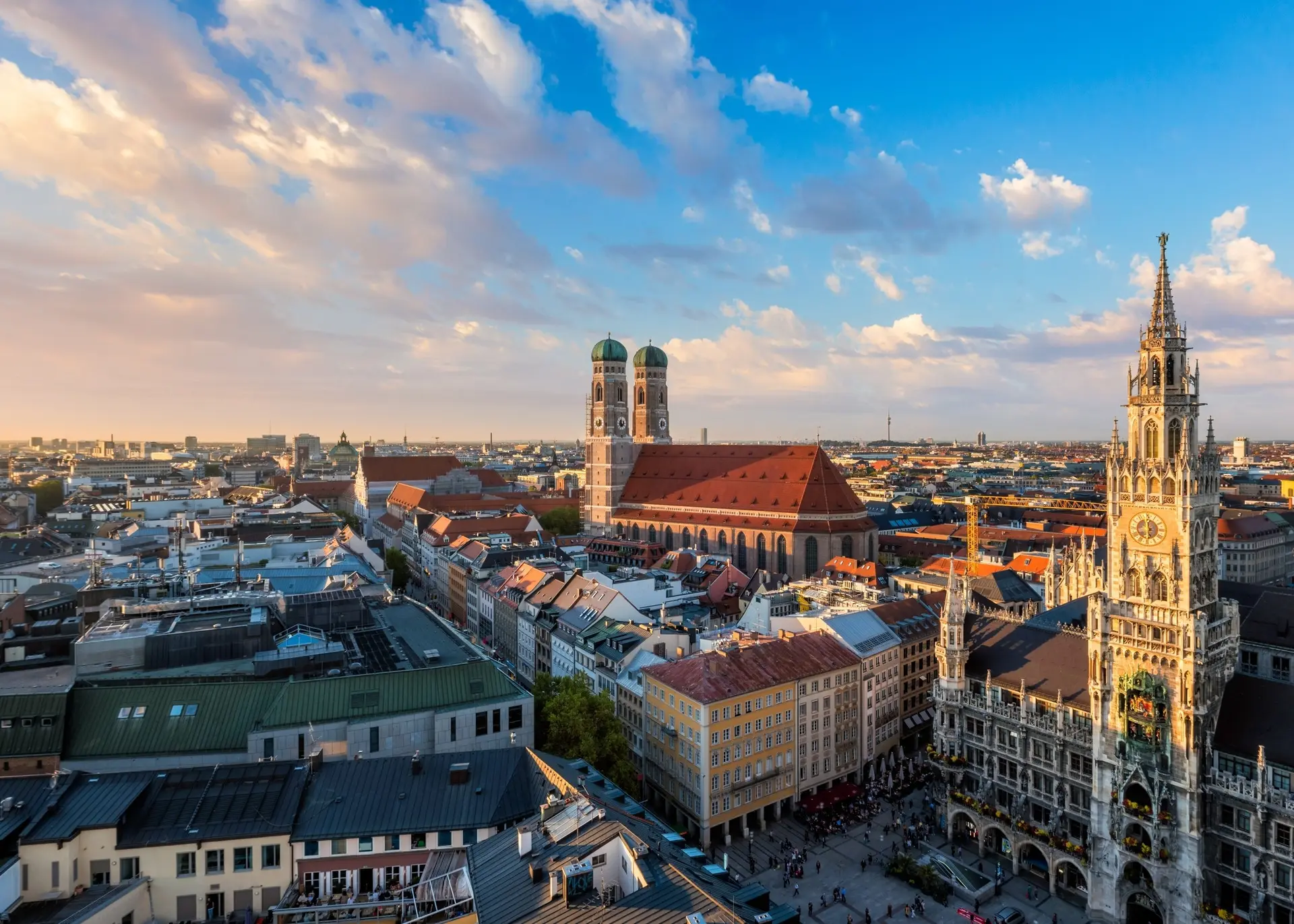 The twin domed towers of the Frauenkirche above the old town rooftops of Munich, for Sylvie di Giusto, international keynote speaker in Munich