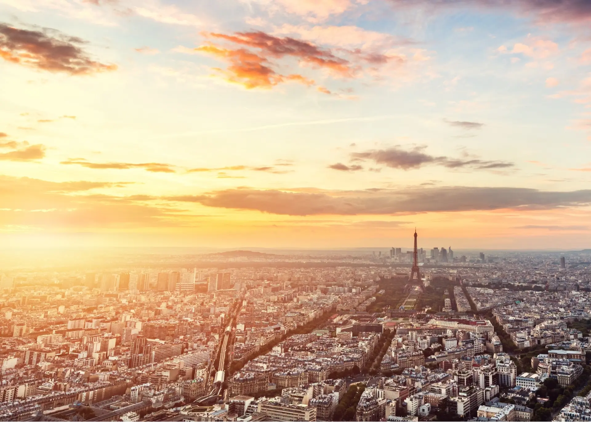 The Eiffel Tower rising above the rooftops of Paris, for Sylvie di Giusto, international keynote speaker in Paris