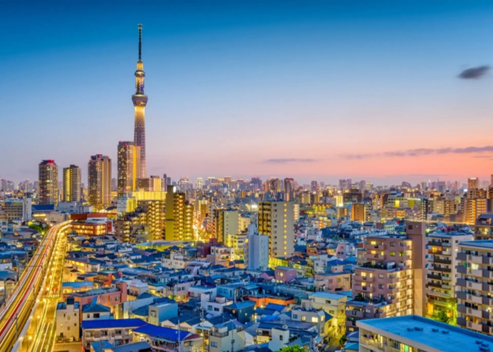 Tokyo Skytree rising above the city skyline at dusk, for Sylvie di Giusto, international keynote speaker in Tokyo